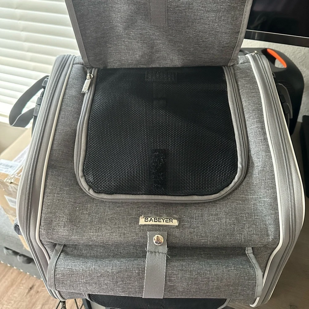 Dog bag is also suitable for the car. It's totally new, with label and plastic.